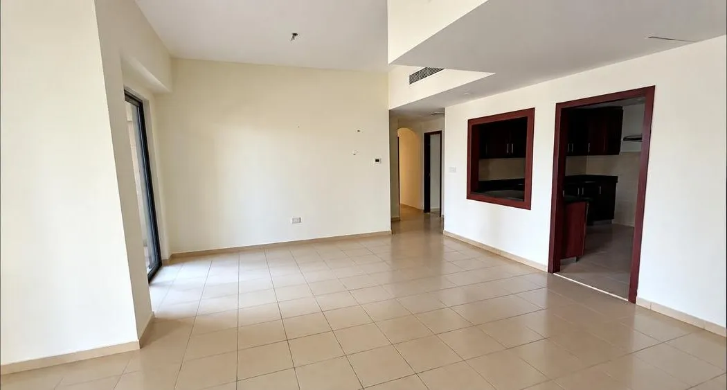 Living room before, with the original beige tile
